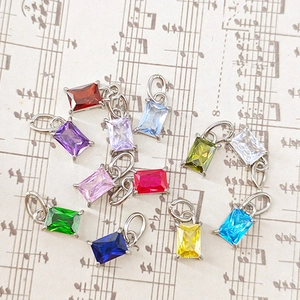 Set of 10 luxury rectangular zircon pendants in vibrant colors on vintage music sheet