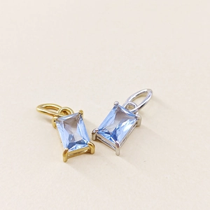 Rectangle light blue gemstone pendants in gold and silver plating with four-prong settings