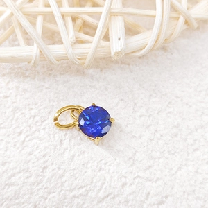 Detailed macro view of 18k gold plated sapphire birthstone pendant for DIY jewelry