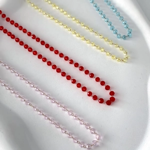 Minimalist crystal beaded necklace set in pink, red, yellow and blue faceted glass beads