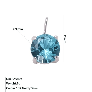 Detailed view of a 6x6mm round aquamarine zircon pendant in a four-prong silver setting