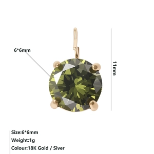 Macro shot of 6x6mm round olive green zircon pendant with 18K gold plated four-prong setting