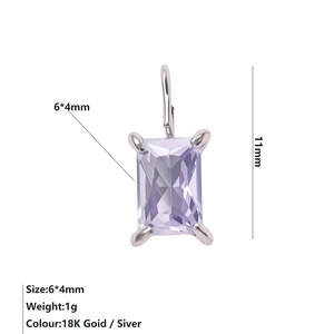 Macro detail of a 6x4mm purple rectangle zircon pendant with silver claw setting