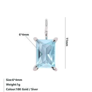 Detail view of a 6x4mm light blue rectangular zircon pendant with silver claw setting