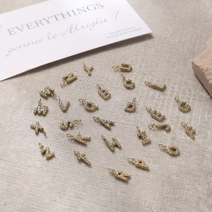 26 piece set of 18K gold plated alphabet letter pendants with sparkling micro-pave crystals