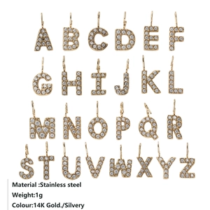 Gold plated stainless steel alphabet pendant set with sparkling cubic zirconia crystals