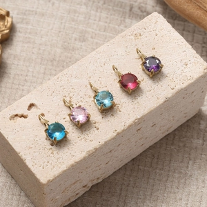 Five colored zircon round pendants with gold plated four-claw settings for DIY jewelry