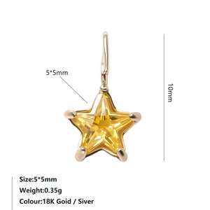 Macro detail of 5x5mm star pendant with yellow zircon in 18K gold-plated setting