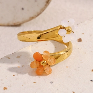 Detailed macro shot of 18K gold plated floral open ring with colorful bead accents