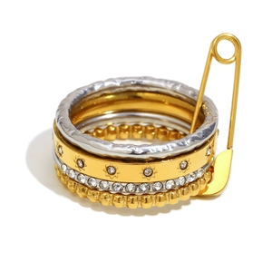 Chic 18K gold plated stainless steel stacked ring set with star charms and safety pin detail
