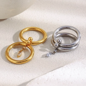 Detail of 18K gold plated double layer steel ring with marquise cut zircon charms