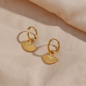 Bohemian gold stainless steel fan-shaped earrings on elegant champagne silk fabric