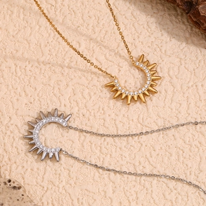 18K gold and silver plated Indian chief style necklace with sparkling zircons on a rock background