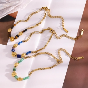 Detailed close-up of 18K gold plated stainless steel bracelets with assorted natural stones