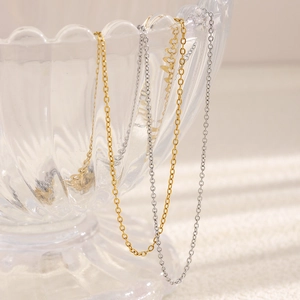 Collares minimalistas de cadena cruzada de acero inoxidable de 1,4 mm en oro 18K y plata