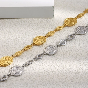 Bracelet rétro en acier inoxydable doré 18 carats avec disques à texture spirale