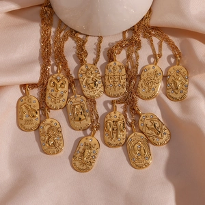 Detailed set of twelve zodiac gold coin pendant necklaces with oval embossed zircon charms