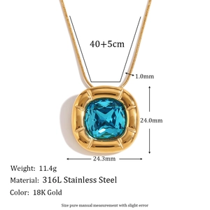 Detail of vintage square blue stone pendant on 18K gold plated stainless steel snake chain