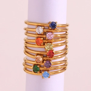 Detailed stack of 18K gold plated stainless steel rings with colorful birthstones