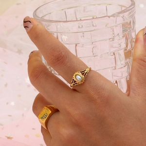 Gold stainless steel ring set with freshwater pearl and engraved signet style