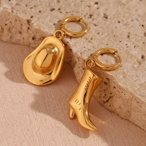 Detailed close-up of 18K gold-plated western cowboy hat and boot asymmetric hoop earrings