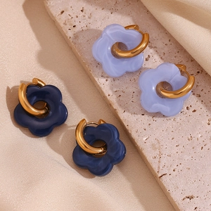 Detail of lavender and navy resin flower earrings with 18K gold plated hoop accents