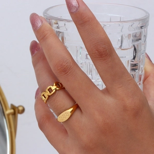 Detail of 18K gold plated chain ring and oval signet ring with 333 engraving