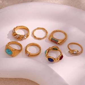 Detailed set of seven vintage 18K gold-plated stainless steel rings with natural stones