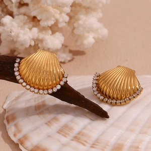 Detail of 18K gold plated seashell stud earrings with sparkling zircon stones