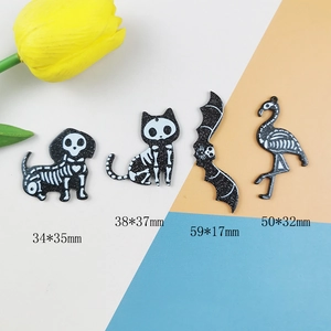 Set of four black glitter acrylic Halloween skeleton pendants for DIY jewelry charms