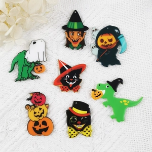 7-piece set of Halloween acrylic pendants featuring festive dinosaurs, cats, and pumpkins