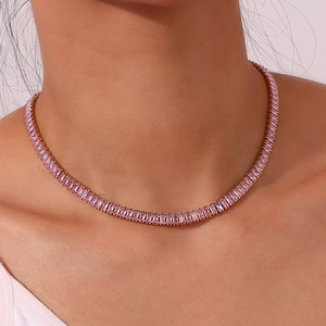 Detail of 18K gold plated tennis necklace with rectangular pink zircon stones