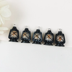 Cinco colgantes de lámpara de queroseno vintage en resina negra y naranja con aros