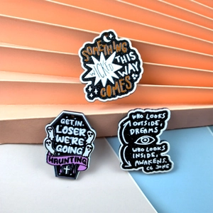 Three gothic punk acrylic ghost pendants with mystical quotes on colorful tiered background