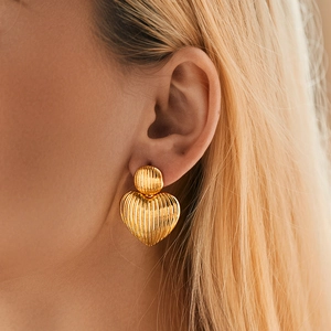 Textured 18K gold plated heart earrings featuring a stylish vertical ribbed metal design