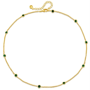 Detailed view of an 18K gold-plated necklace with eleven round green zircon stones
