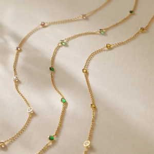 Vintage golden necklace with colorful zircon gemstones in various pastel shades
