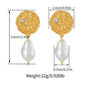 Detailed view of baroque pearl gold coin earrings with irregular hammered texture