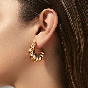 Polished 18K gold plated C-shaped irregular ribbed hoop earrings for women stylish wear