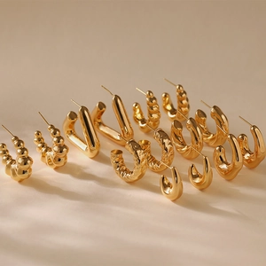 Gold plated vintage earrings set featuring geometric bead, V-shape and spiral designs