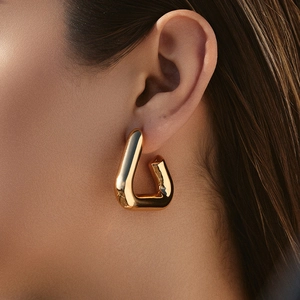 Modern gold plated U-shaped geometric earrings with high polish metallic finish