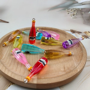 Miniature resin wine bottle charms with metal loops in various transparent colors