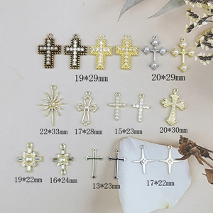 Assorted cross charms for jewelry making in gold and silver with pearl accents