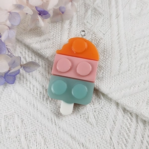 Close-up of a resin ice cream pendant with block textures for DIY keychains