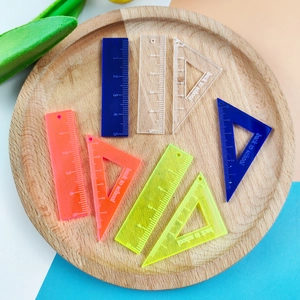Set of colorful acrylic 5cm rulers and triangles featuring back to school design