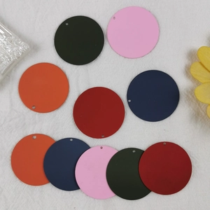 Flat lay of colorful DIY round pendant charms for earrings and necklace jewelry