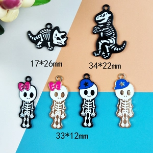 Halloween enamel skeleton charms featuring dinosaur bones and skull figures for jewelry DIY