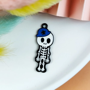 Detail of cartoon skeleton charm with blue baseball cap and star for DIY jewelry