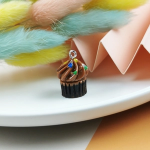 Detail of chocolate cupcake charm with colorful sprinkles and silver ring for DIY projects