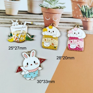 Flat lay of cartoon rabbit and puppy alloy charms with size dimensions in millimeters